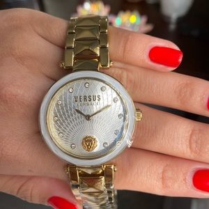 Versace Versus gold watch with Versace lion logo inside